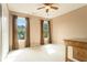 Bedroom featuring hardwood trim, carpet floors, and natural light at 5215 Tealing Ne Dr, Roswell, GA 30075