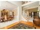 Grand foyer with hardwood floors, a chandelier, an elegant staircase, and dining room view at 5215 Tealing Ne Dr, Roswell, GA 30075