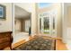 Bright foyer featuring hardwood floors, stained glass door, and elegant staircase at 5215 Tealing Ne Dr, Roswell, GA 30075