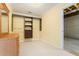 Walk-in closet with installed shelving and drawers alongside an unfinished portion of the basement at 5215 Tealing Ne Dr, Roswell, GA 30075