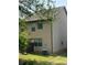 Home's backyard featuring green grass, AC unit and privacy fencing at 11813 Lovejoy Crossing Blvd, Hampton, GA 30228