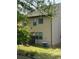 Home's backyard featuring green grass, AC unit and privacy fencing at 11813 Lovejoy Crossing Blvd, Hampton, GA 30228