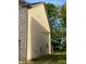 View of home's side yard featuring brick and siding exterior and small lawn at 11813 Lovejoy Crossing Blvd, Hampton, GA 30228