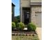 Inviting front entrance featuring brick facade, manicured landscaping, and covered porch at 11813 Lovejoy Crossing Blvd, Hampton, GA 30228