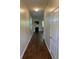 Open-concept living area with hardwood floors, fireplace, and natural light creates a cozy space at 11813 Lovejoy Crossing Blvd, Hampton, GA 30228