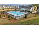 Aerial view of the community pool and clubhouse, surrounded by new construction homes at 2670 Brookview Nw Ln, Atlanta, GA 30318