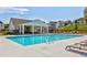 Community pool with lounge chairs, clubhouse, and new construction homes in the background at 2670 Brookview Nw Ln, Atlanta, GA 30318
