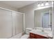 Well-lit bathroom with a shower-tub combination and a vanity with sink at 2725 Sedgeview Way, Buford, GA 30519