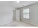 Bedroom featuring carpeted flooring, a window, and a doorway at 2725 Sedgeview Way, Buford, GA 30519