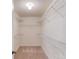 Walk-in closet with ample shelving and carpeted floor at 2725 Sedgeview Way, Buford, GA 30519