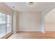 Dining room with large window, hardwood floors, and access to additional rooms at 2725 Sedgeview Way, Buford, GA 30519