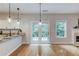Dining area features pendant lighting and French doors leading to the backyard at 2725 Sedgeview Way, Buford, GA 30519