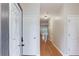 Bright foyer with hardwood floors, white trim, and a view into the living spaces at 2725 Sedgeview Way, Buford, GA 30519