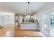 Open kitchen with stainless steel appliances, breakfast bar, and a view of the patio at 2725 Sedgeview Way, Buford, GA 30519