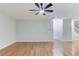 Spacious living room with hardwood floors and neutral wall color at 2725 Sedgeview Way, Buford, GA 30519