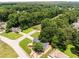 Aerial view of the home surrounded by lush greenery, featuring a well-manicured lawn and landscaping at 2790 Shiloh Way, Snellville, GA 30039