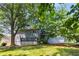 Picture of a spacious backyard with a deck and mature trees at 2790 Shiloh Way, Snellville, GA 30039