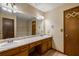 Bathroom showcasing dual sinks, a spacious vanity, and well-lit mirror at 2790 Shiloh Way, Snellville, GA 30039