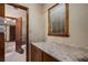 Bathroom area featuring a vanity and entrance to the water closet with toilet and shower tub at 2790 Shiloh Way, Snellville, GA 30039
