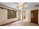Bedroom with carpet, neutral walls, wooden window frames, and ceiling fan at 2790 Shiloh Way, Snellville, GA 30039