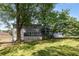 Exterior backyard view shows large deck, manicured lawn and home at 2790 Shiloh Way, Snellville, GA 30039