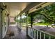 Covered front porch providing an outdoor space to relax and enjoy the surrounding scenery at 2790 Shiloh Way, Snellville, GA 30039