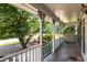 Spacious porch with white railings is perfect for enjoying the outdoors from this charming residence at 2790 Shiloh Way, Snellville, GA 30039