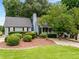 Charming home featuring a well-maintained lawn and mature landscaping, creating an inviting curb appeal at 2790 Shiloh Way, Snellville, GA 30039