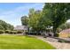 Lovely front yard with lush green grass and mature trees, providing a serene and picturesque setting at 2790 Shiloh Way, Snellville, GA 30039