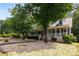 Inviting home featuring a well-maintained front yard with lush landscaping and established trees at 2790 Shiloh Way, Snellville, GA 30039