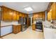 View of kitchen with stainless steel appliances and wood cabinets at 2790 Shiloh Way, Snellville, GA 30039