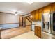 View of kitchen and dining room with wood cabinets at 2790 Shiloh Way, Snellville, GA 30039