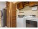 Convenient laundry room featuring a modern washer and dryer, and extra storage at 2790 Shiloh Way, Snellville, GA 30039
