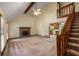 Open living room features a brick fireplace, vaulted ceiling, and staircase at 2790 Shiloh Way, Snellville, GA 30039