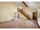 Spacious living room with vaulted ceiling and wood staircase at 2790 Shiloh Way, Snellville, GA 30039