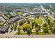 Aerial view of a park, amphitheater, and surrounding community in a vibrant setting at 527 Main St, Suwanee, GA 30024