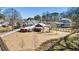 Large backyard with multiple buildings and ample space, perfect for outdoor activities and gatherings at 527 Main St, Suwanee, GA 30024
