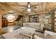 Open basement area with seating, fireplace, and colorful wood accent walls at 527 Main St, Suwanee, GA 30024