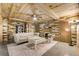 Open basement space with fireplace, seating, and colorful wood accent walls at 527 Main St, Suwanee, GA 30024