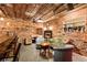 Finished basement with brick walls, wet bar, and lounge area at 527 Main St, Suwanee, GA 30024