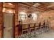 Finished basement with brick walls featuring bar with seating at 527 Main St, Suwanee, GA 30024