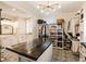 Luxurious bathroom with an island, custom closet and tile floor near the tub and vanity at 527 Main St, Suwanee, GA 30024