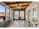 Enclosed sunroom/patio with wood ceiling and wall accents plus stone flooring at 527 Main St, Suwanee, GA 30024