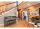 Welcoming entryway with piano, wooden accents, and a view of the upper level at 527 Main St, Suwanee, GA 30024