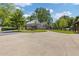 Wide driveway with a basketball hoop and a traditional style home at 527 Main St, Suwanee, GA 30024