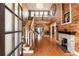 Warm and inviting foyer features beautiful wood floors, staircase, and fireplace at 527 Main St, Suwanee, GA 30024