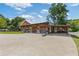Unique detached garage with covered parking and red exterior at 527 Main St, Suwanee, GA 30024