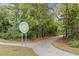 Scenic Brushy Creek Greenway walking trail surrounded by lush greenery and mature trees at 527 Main St, Suwanee, GA 30024