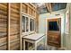 Unique hallway with rustic wooden accents, plus a whitewashed work table at 527 Main St, Suwanee, GA 30024