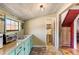 Cozy kitchen with laminate countertop, ample sunlight, and a glimpse of the adjacent bathroom at 527 Main St, Suwanee, GA 30024